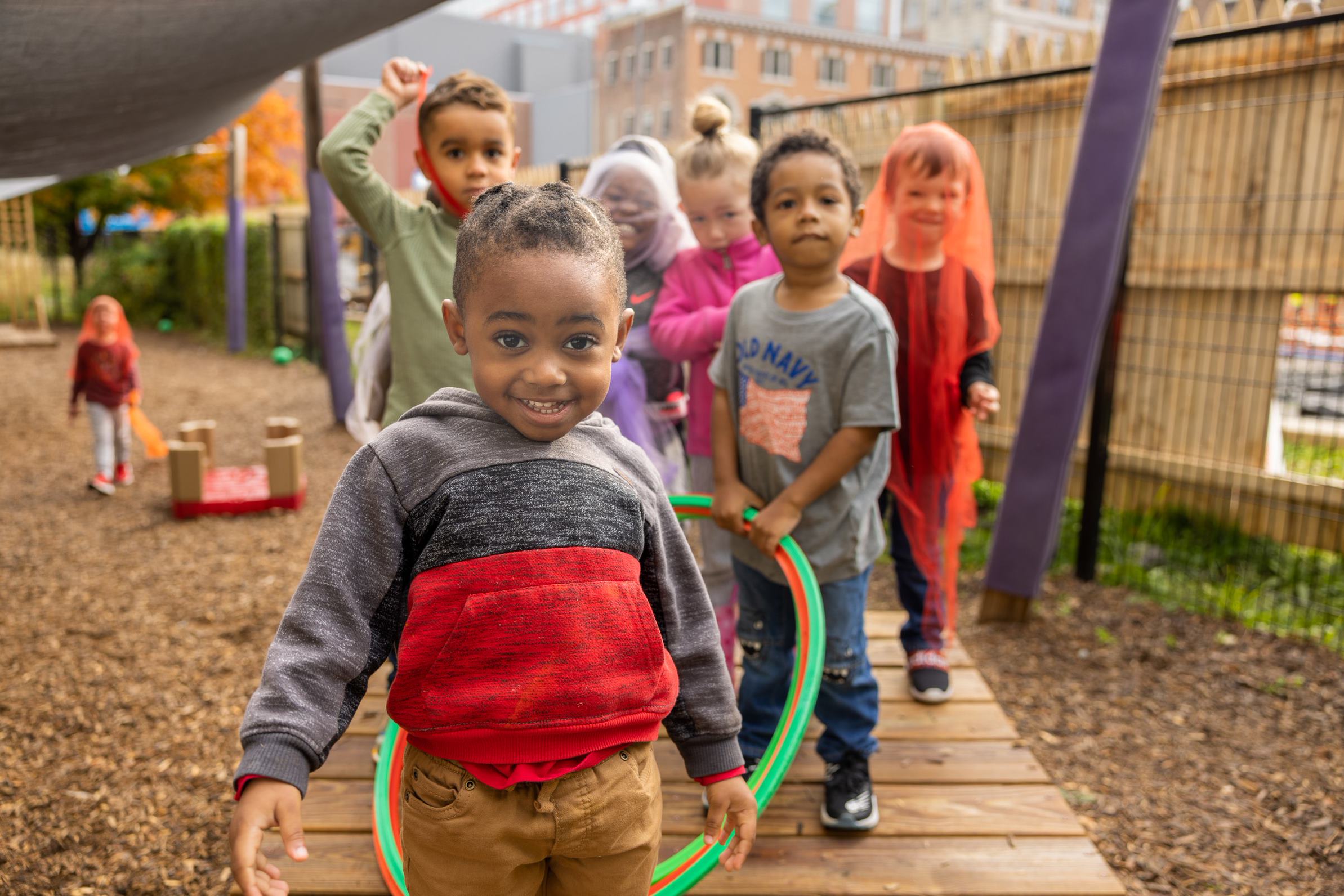 children on playground looking at camera